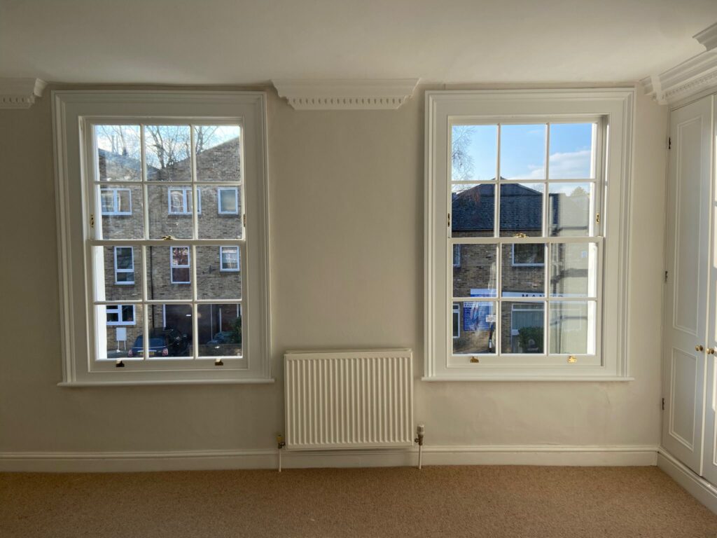Photo of box sash windows with K Glass, crafted by Woodcock Sash Windows.