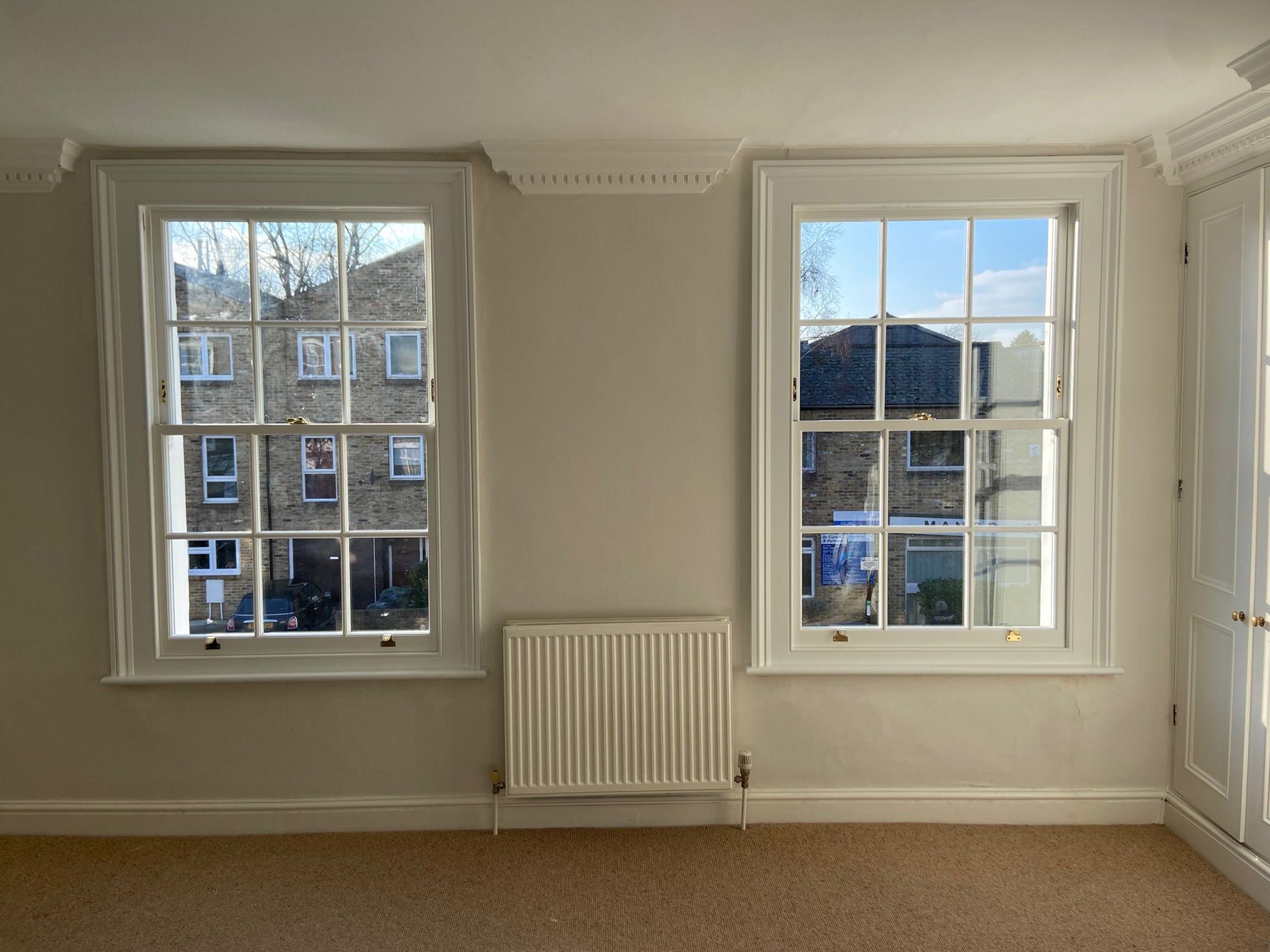 Photo of box sash windows with K Glass, crafted by Woodcock Sash Windows.