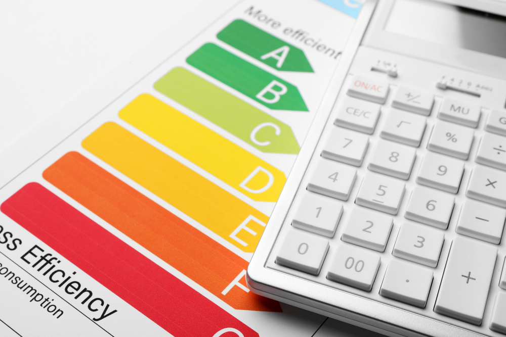 Photo of an Energy Performance Certificate (EPC) document with a calculator placed on top, representing changes to EPC calculations.