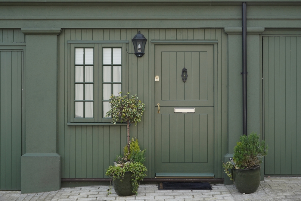 Image of a green timber front door.